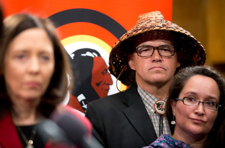 Sen. Maria Cantwell, D-Wa., from left, President of National Congress of American Indians (NCAI) and Chairman of the Swinomish Tribe Brian Cladoosby, and Amy Sarck Dobmeier of the Qissunamiut Tribe of Alaska join other native Americans and lawmakers during a news conference on Capitol Hill in Washington, Tuesday, Sept. 16, 2014, to pressure the Washington Redskins football team to change their name. Cantwell says she will introduce a bill to eliminate the NFL's tax-exempt status because the league has not taken action over the Washington Redskins name.