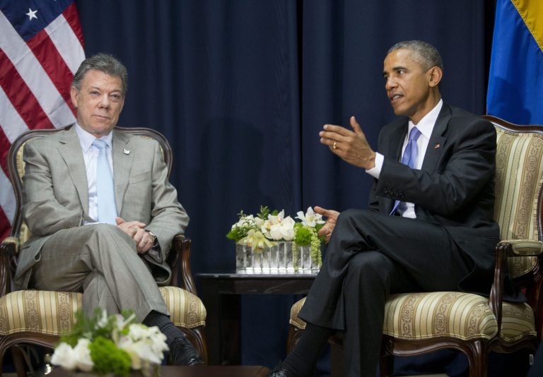 US President Barack Obama, right, with Colombian President Juan Manuel Santos, left, during their bilateral meeting at the Summit of the Americas in Panama City, Panama, Saturday, April 11, 2015. (AP Photo/Pablo Martinez Monsivais)