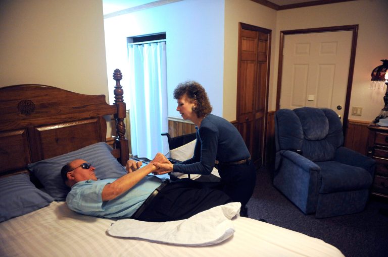 In this Aug. 30, 2013 photo, Pauline King cares for her husband Jerry King at their home in Anna, Ill. Jerry was diagnosed with Multiple Sclerosis in 1978. He can no longer go to the bathroom, bathe or dress himself without assistance from Pauline. You promise in sickness and in health, but a new poll shows becoming a caregiver to a frail spouse causes more stress than having to care for Mom, Dad or even the in-laws. Americans count on their families to care for them as they get older, with good reason: Half of people 40 and over already have been caregivers to relatives or friends, the poll found. (AP Photo/Stephen Lance Dennee)