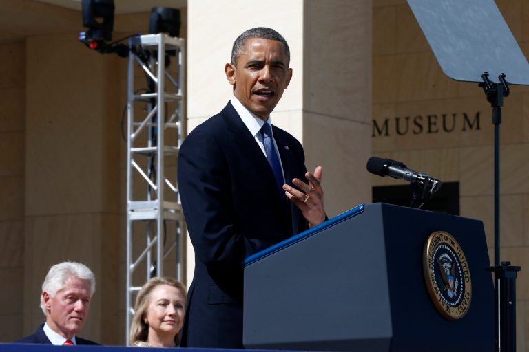 Former President Bill Clinton and his wife, former first lady and former Secretary of State Hillary Clinton listen as President Obama speaks at the dedication of the George W. Bush presidential library on the campus of Southern Methodist University in Dallas, Thursday, April 25, 2013. (AP Photo/Charles Dharapak)