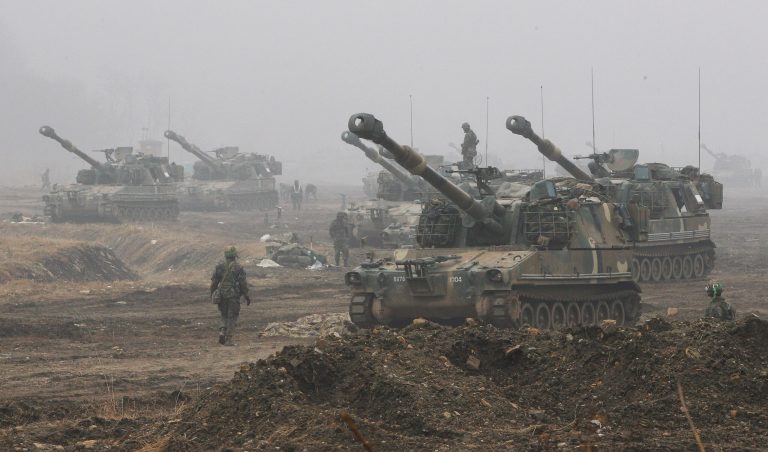 South Korean Marine K-55 self-propelled howitzers are on positions during an exercise against possible attacks by North Korea near the border village of Panmunjom in Paju, South Korea, Wednesday, April 3, 2013. (AP Photo/Ahn Young-joon)