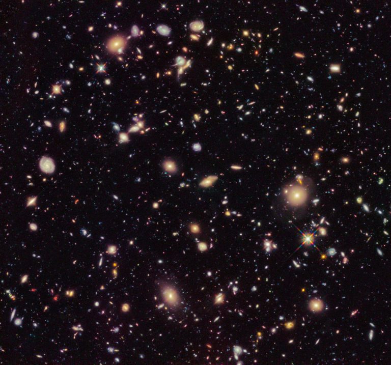   In this image provided by NASA and taken by the Hubble Space Telescope shows previously unseen early galaxies including the oldest one at 13.3 billion years old. Launched in 1990, Hubble has peered deep in time to reveal distant and old galaxies. (AP Photo/NASA)  