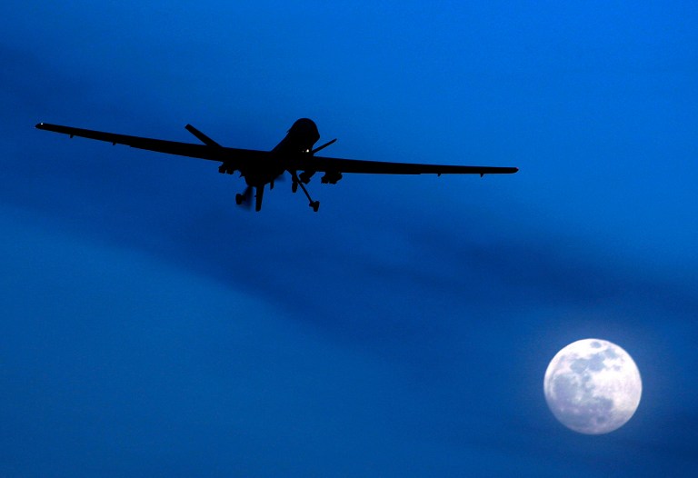   FILE - In this Jan. 31, 2010, file photo an unmanned U.S. Predator drone flies over Kandahar Air Field, southern Afghanistan, on a moon-lit night. The Obama administrationâs increasing use of unmanned drone strikes to kill terror suspects is widely opposed around the world, according to a Pew Research Center survey on the U.S. image abroad. (AP Photo/Kirsty Wigglesworth, File)  