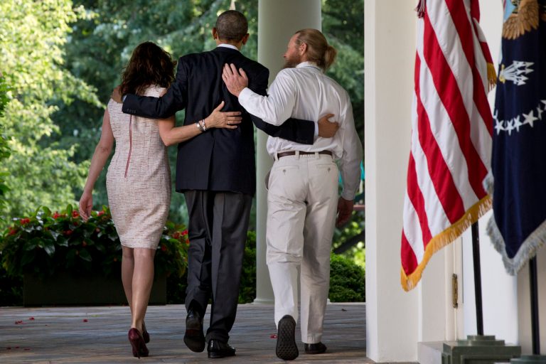 President Obama walks with Jani Bergdahl and her husband, Bob Bergdahl, after he spoke about the release of their son, U.S. Army Sgt. Bowe Bergdahl, in the Rose Garden of the White House in Washington, Saturday, May 31, 2014. Ten months later, the Army has charged Bergdahl with desertion. (AP Photo/Jacquelyn Martin)