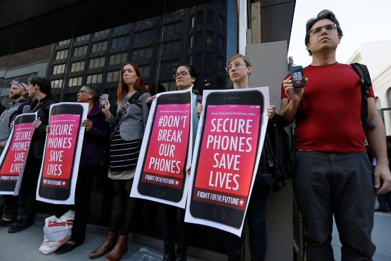 The Justice Department is asking for Apple's assistance in accessing the contents of at least nine iPhones. (AP Photo/Eric Risberg)