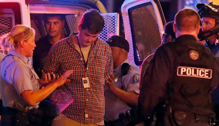 In September 2017, St. Louis Post-Dispatch reporter Mike Faulk was arrested while covering protests in St. Louis. (AP Photo/Jeff Roberson)