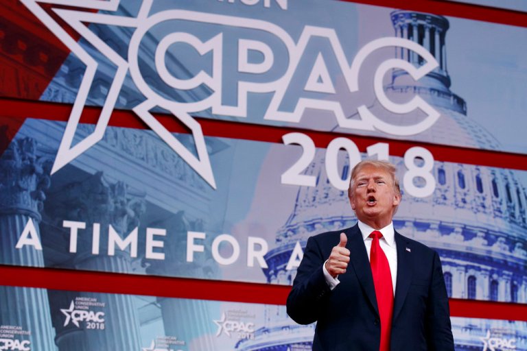 In this Feb. 23, 2018, photo, President Donald Trump gives a thumbs up after speaking at the Conservative Political Action Conference In Oxon Hill, Md. On the offensive about his record and the defensive about the Russia investigation, Trump sought in a week's worth of rhetoric to show that he is outdoing his predecessor, if not all of history. This made for inflated claims. (AP Photo/Evan Vucci)