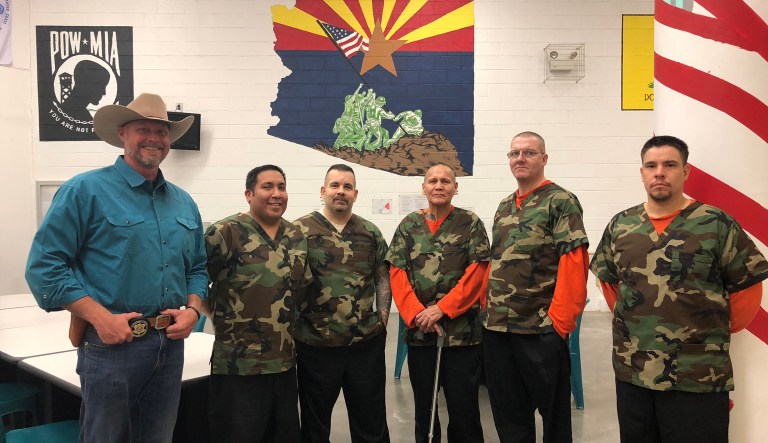 Pinal County Sheriff Mark Lamb stands with inmates in the HUMV unit of the county jail. (Photo: Pinal County Sheriff's Office)