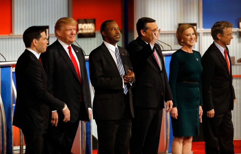 Republican presidential candidates John Kasich, Jeb Bush, Marco Rubio, Donald Trump, Ben Carson, Ted Cruz, Carly Fiorina and Rand Paul take the stage during Republican presidential debate at Milwaukee Theatre, Tuesday, Nov. 10, 2015, in Milwaukee. (AP Photo/Morry Gash)