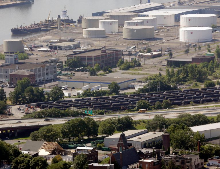 FILE - In this July 16, 2013, file photo, railroad oil tankers are lined up at the Port of Albany in Albany, N.Y. While the federal government has ordered railroads to give states details about shipments of volatile crude oil from North Dakota's Bakken shale region, New York officials haven't decided whether to share that information with the public. (AP Photo/Mike Groll, File)