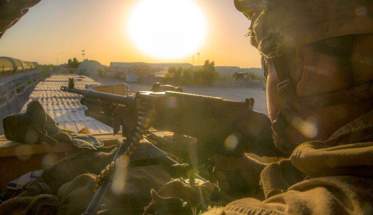 NIMROZ PROVINCE, Afghanistan (July 9, 2018) - A U.S. Marine with Task Force Southwest stands post during an expeditionary advisory package at forward operating base (FOB) Delaram. U.S. Marines spent approximately one week at FOB Delaram to conduct security meetings with key leaders from Nimroz province and to develop rapport and advise their Afghan National Defense & Security Forces counterparts.