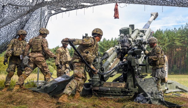 U.S. Soldiers assigned to 1st Platoon, C Battery, 4th Battalion, 319th Airborne Field Artillery Regiment, 173rd Airborne Brigade load a M777 howitzer during a live fire exercise as part of Saber Junction 18 at the 7th Army Training Command's Grafenwoehr Training Area, Germany, Sept. 10, 2018. Exercise Saber Junction 18 is a U.S. Army Europe-directed exercise designed to assess the readiness of the U.S. Army's 173rd Airborne Brigade to execute unified land operations in a joint, combined environment and to promote interoperability with participating allies and partner nations.