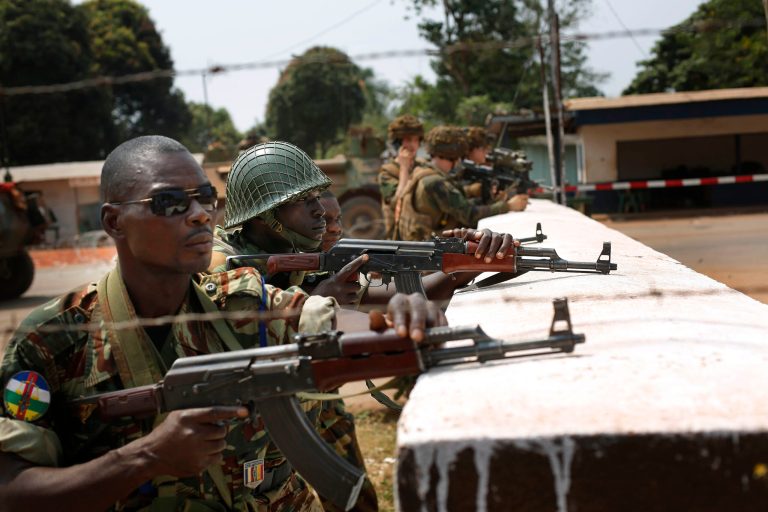 FILE - In this Thursday, Jan. 23, 2014 file photo, African Union peacekeepers and French troops take position at the PK11 checkpoint in Bangui, Central African Republic. The government of Chad said Thursday, April 3, 2014, it is withdrawing more than 800 peacekeepers from a mission to stabilize neighboring Central African Republic after the Chadian troops came under scrutiny for firing into a crowd of civilians last week, killing at least 32 people. (AP Photo/Jerome Delay, File)