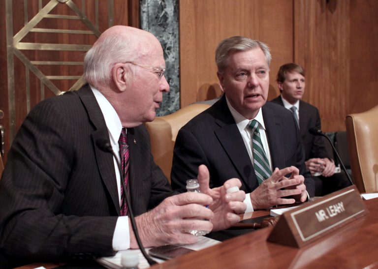 Senate Appropriations Committee, State, Foreign Operations, and Related Programs subcommittee Chairman Sen. Lindsey Graham, R-S.C., right, talks to the subcommittee's ranking member Sen. Patrick Leahy, D-Vt., on Capitol Hill in Washington, Thursday, March 26, 2015, during the subcommittee's hearing on diplomacy, development and national security. (AP Photo/Lauren Victoria Burke)