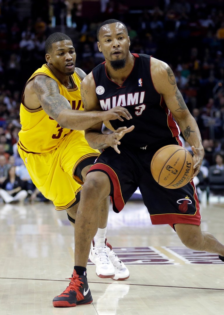 FILE - In this April 15, 2013, file photo, Cleveland Cavaliers' Alonzo Gee, left, tries to knock the ball away from Miami Heat's Rashard Lewis in the first quarter of an NBA basketball game in Cleveland. A guilty plea is expected in the case of Haider Zafar, charged with a multimillion-dollar investment scam involving Lewis and two former Miami Heat players. (AP Photo/Mark Duncan, File)