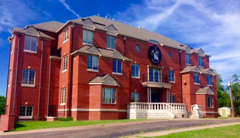 Two Phi Delta Theta brothers hung a banner that said 