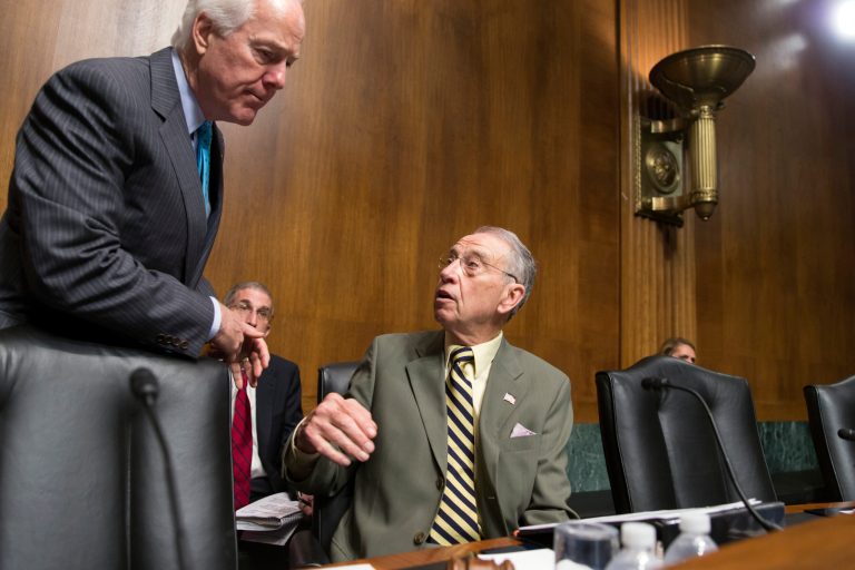 Sen. John Cornyn, R-Texas, confers with Senate Judiciary Committee Chairman Chuck Grassley, R-Iowa. The two are shopping around changes to a criminal justice reform bill they hope can get a vote in the Senate. (AP Photo/J. Scott Applewhite)
