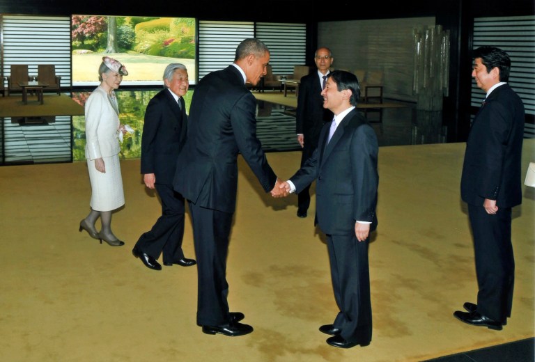 President Obama, third left, shakes hands with Japan's Crown Prince Naruhito, second right, as Japan's Emperor Akihito, second left, Empress Michiko and Japan's Prime Minister Shinzo Abe, right, look on, upon Obama's arrival at the Imperial Palace for the welcoming ceremony in Tokyo Thursday, April 24, 2014. (AP Photo/Imperial Household Agency of Japan)