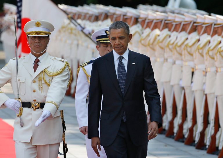 U.S. President Barack Obama, center, reviews an honor guard during a welcome ceremony at the Imperial Palace in Tokyo, Thursday, April 24, 2014. (AP Photo/Shizuo Kambayashi, Pool)