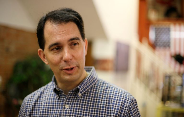 Republican presidential candidate Wisconsin Gov. Scott Walker speaks during a meet and greet with local residents, Thursday, in Greenfield, Iowa. (AP Photo/Charlie Neibergall)