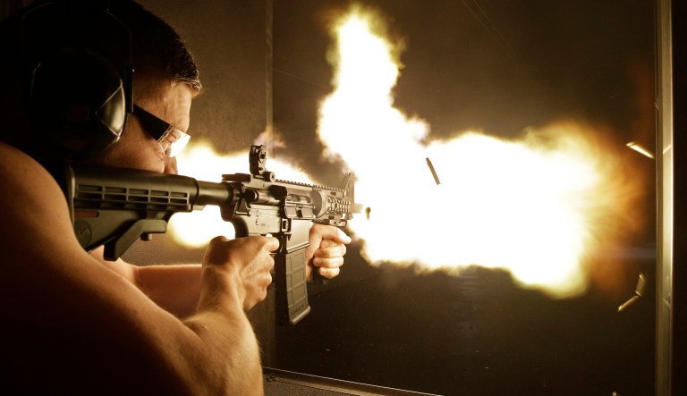 To legally own a fully-automatic weapon requires three things: money, time, and an absolutely pristine criminal record. (AP Photo/John Locher)