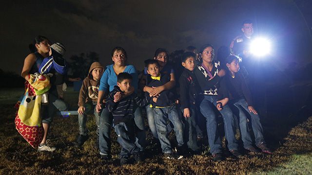 Welcome. This June 25, 2014 photo shows a group of immigrants from Honduras and El Salvador who crossed the U.S.-Mexico border illegally as they are stopped in Granjeno, Texas. (AP Photo/Eric Gay)
