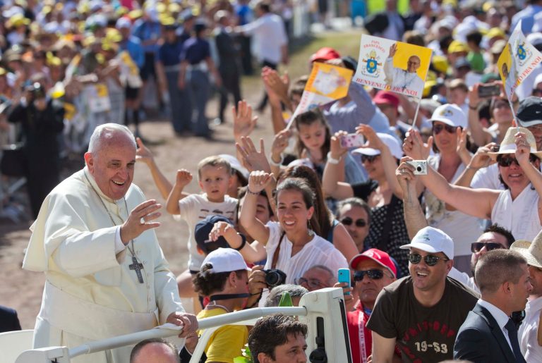 FILE - In this July 5, 2014 file photo, Pope Francis smiles as he arrives to give a mass in Campobasso, Italy, during his one day trip to the southern Italian region of Molise. The Vatican confirmed Tuesday, July 29 the dates for Pope Francis' second trip to Asia, a weeklong visit Jan. 12-19 to Sri Lanka and the Philippines. (AP Photo/Alessandra Tarantino, File)