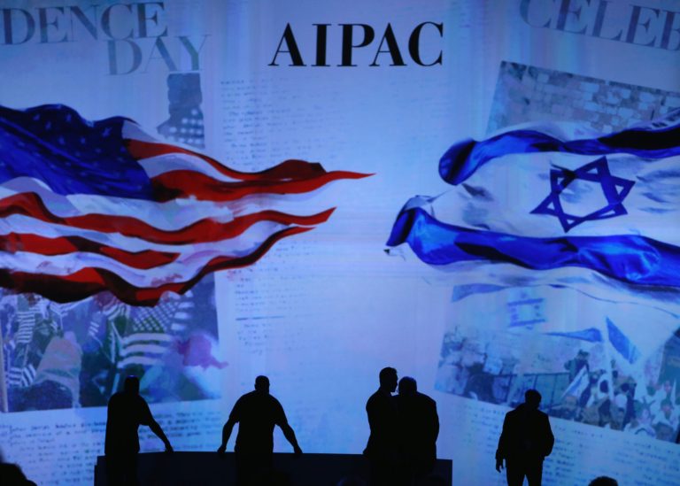 Workers prepare the stage before for Israeli Prime Minister Benjamin Netanyahu address to the American Israel Public Affairs Committee 2015 Policy Conference, March 2, 2015 in Washington. (Photo by Mark Wilson/Getty Images)