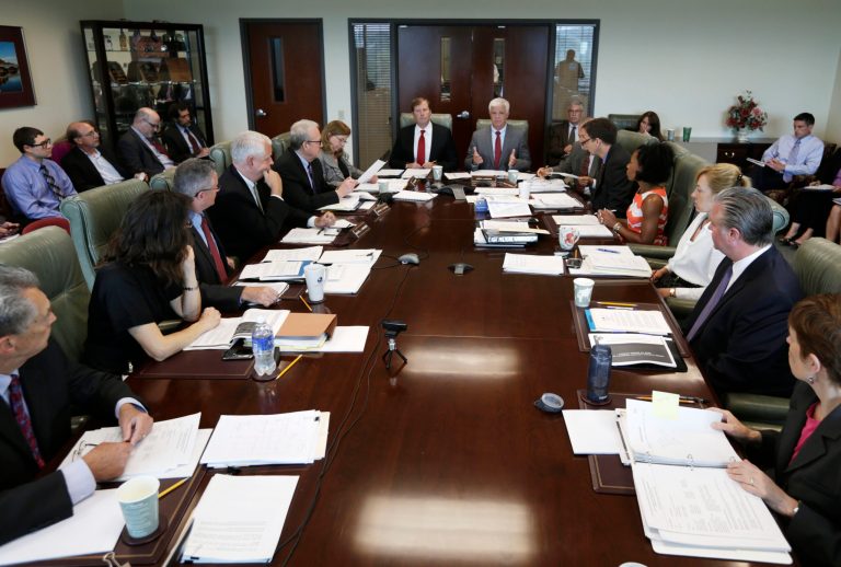 New York State Department of Environmental Conservation Commissioner Joseph Martens, right, speaks during a board meeting of the New York State Environmental Facilities Corp. as Matthew Driscoll, president of the EFC, listens on Thursday, June 26, 2014, in Albany, N.Y. The EFC has approved Gov. Andrew Cuomo's plan to use $511 million in loans from a clean water fund to help finance the new Tappan Zee Bridge. It's now subject to approval by the Thruway Authority and Public Authorities Control Board. (AP Photo/Mike Groll)