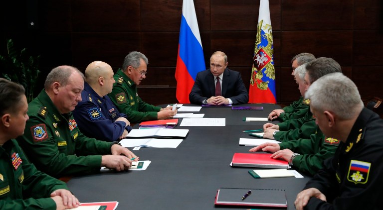 Russia has vowed to take steps that would counteract the new U.S. policy. Above, Russian President Vladimir Putin, center, leads a meeting with high level Russian military officials and Defence Minister Sergei Shoig. (Mikhail Klimentyev, Sputnik, Kremlin Pool Photo via AP)