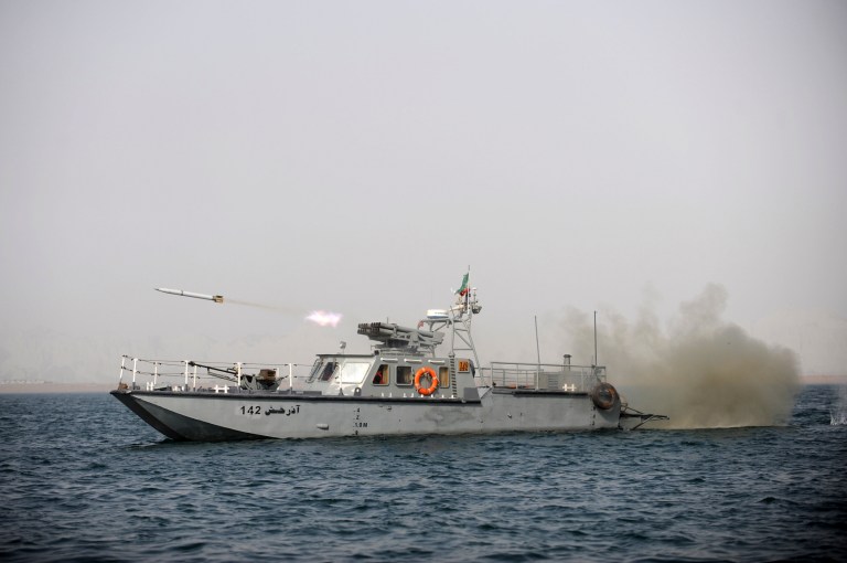An Iranian navy vessel fires a missile in a drill in the sea of Oman, on Friday, Dec. 30, 2011. (AP Photo)