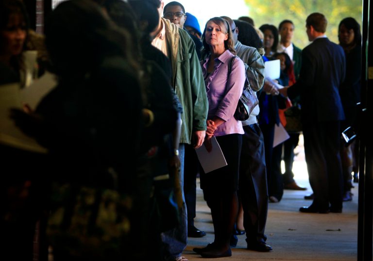 Jona Caldwell joins a long line of job seekers outside the Ferguson Community Center in Cordova, Tenn. (AP/Jim Weber)