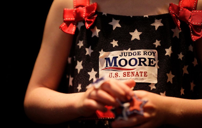 Roy Moore's loyal backers gathered in rural southwestern Alabama ahead of Tuesday's GOP primary runoff in this closely watched special election less than 24 hours after Trump stumped for Sen. Luther Strange to the north in Huntsville, expressing their disappointment and vowing it would make little difference in the outcome. (AP Photo/Brynn Anderson)