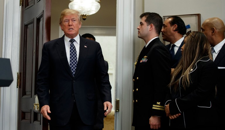 President Trump did not respond to any of the questions as he shook hands with aides and guests who had joined him for the ceremony. (AP Photo/Evan Vucci)