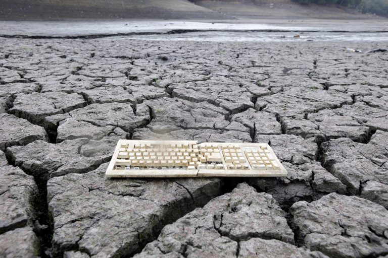 AP10ThingsToSee - A discarded computer keyboard lies on the dry, cracked bed of the Almaden Reservoir in San Jose, Calif. on Friday, Feb. 7, 2014 during the state's worst drought in recorded history. (AP Photo/Marcio Jose Sanchez)
