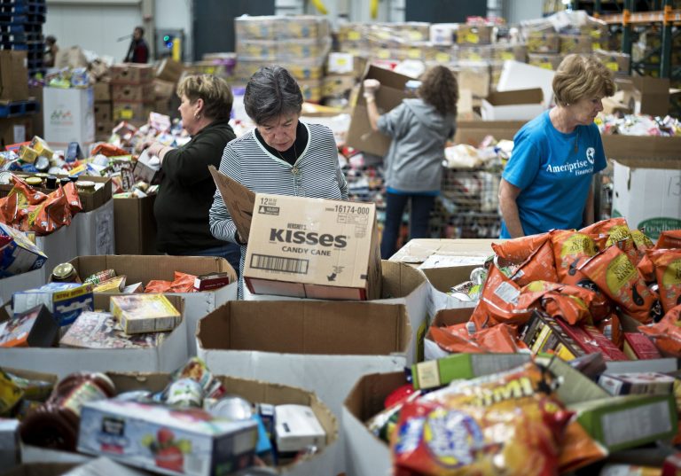 Volunteers sort donated food at the Capital Area Food Bank November 14, 2013 in Washington, DC. The Bedford Falls Foundation Food Distribution Center is the Capital Area Food Bank's hub for getting food to its partners and other charities to feed those who cannot afford to feed themselves. AFP PHOTO/Brendan SMIALOWSKIBRENDAN SMIALOWSKI/AFP/Getty Images