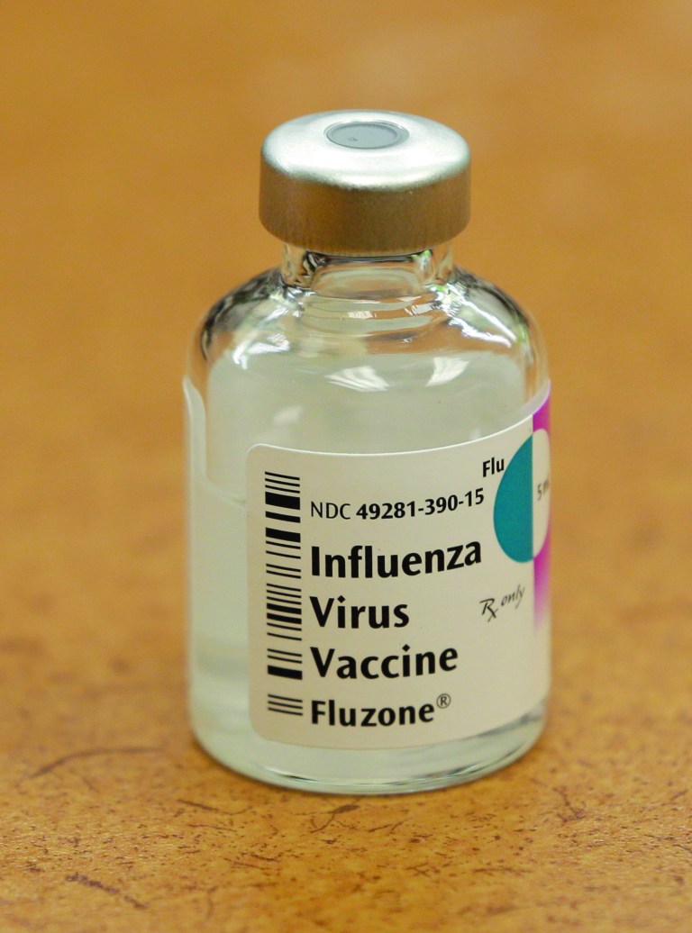 This Thursday, Jan. 10, 2013 photo shows a vial of flu vaccine resting on a countertop at MetroHealth in Cleveland. Ohio health authorities reported Friday, Jan. 11, 2013 that a child has died from flu complications, as the state's flu-associated hospitalizations continue to climb at much higher rates than the last two flu seasons. (AP Photo/Tony Dejak)
