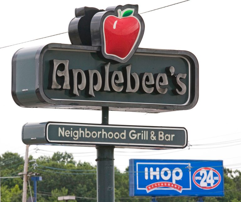 An Applebee's sign appears opposite an IHOP sign on Route 46 in Totowa, New Jersey, Monday, July 16, 2007. Ihop Corp., the largest U.S. pancake-house chain, agreed to buy Applebee's International Inc. for $1.9 billion and sell securities backed by franchisee fees to finance the purchase. Photographer: Emile Wamsteker/Bloomberg News.