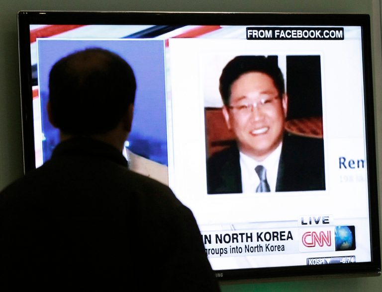 A South Korean man watches a television news program showing Korean American Kenneth Bae at the Seoul Railway Station in Seoul, South Korea, Thursday, May 2, 2013. Bae detained for six months in North Korea has been sentenced to 15 years of hard labor for 
