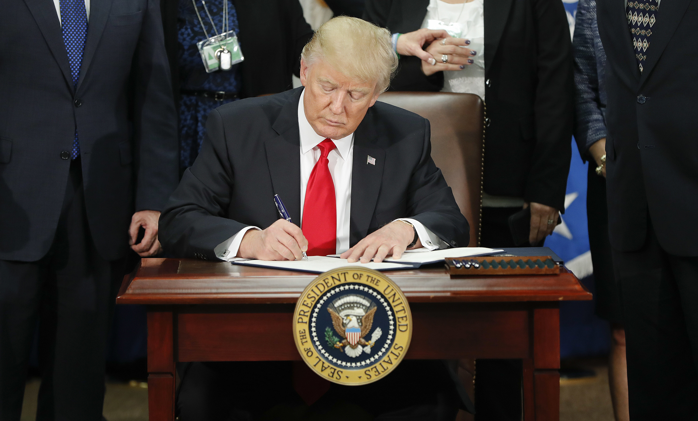 Trump signs orders to rebuild the military, conduct ‘extreme vetting’ of immigrants