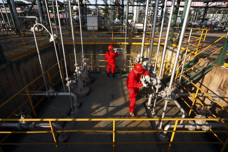 In this Monday, Nov. 15, 2010 photo, PetroChina workers perform their routine check on the Moxi Natural Gas Purification Plant in Suining in southwest China's Sichuan province. The presidents of China and Russia are expected to sign a natural gas deal years in the making next week that would come at a sensitive time as the West is trying to isolate Russia for its annexation of Crimea. (AP Photo) CHINA OUT