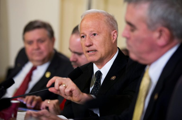 For Rep. Coffman (center), his claim to have been in combat zones earns him a Post 