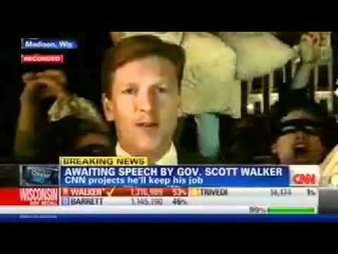Protesters swarm CNN with money bags and vuvuzelas
