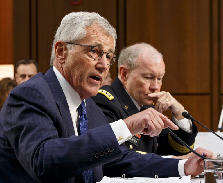 Defense Secretary Chuck Hagel, left, and Army Gen. Martin Dempsey, chairman of the Joint Chiefs of Staff, appear before the Senate Armed Services Committee, the first in a series of high-profile Capitol Hill hearings that will measure the president's ability to rally congressional support for President Barack Obama's strategy to combat Islamic State extremists in Iraq and Syria, in Washington, Tuesday, Sept. 16, 2014. Obama last week outlined his military plan to destroy the extremists, authorizing U.S. airstrikes inside Syria, stepping up attacks in Iraq and deploying additional American troops, with more than 1,000 now advising and assisting Iraqi security forces to counter the terrorism threat.  (AP Photo/J. Scott Applewhite)