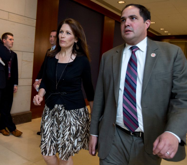 FILE  - This June 11, 2013 file photo shows Rep. Michele Bachmann, R-Minn., arriving with staff member Javier Sanchez on Capitol Hill in Washington. Sanchez has been arrested and charged with thefts that took place in a House office building. A spokesman for the U.S. Capitol Police says 37-year-old Javier Sanchez of Virginia was arrested last Thursday, July 11, 2013. (AP Photo/Manuel Balce Ceneta, file)