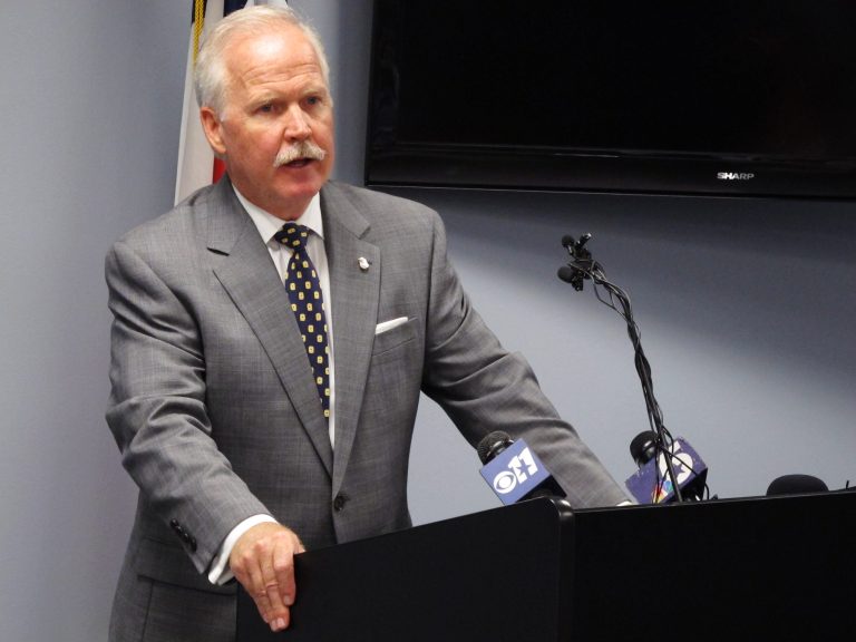 John M. Bales, the U.S. attorney for Texas' eastern district, announces a $34 million settlement with Indian consulting giant Infosys to end a criminal investigation over visa fraud, in Plano, Texas, on Wednesday, Oct. 30, 2013. Infosys was accused of bringing thousands of foreign workers to the United States using incorrect visas, but denied any allegations as part of the settlement.(AP Photo/Nomaan Merchant)