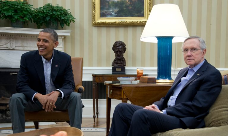 FILE - In this Oct. 12, 2013, file photo President Barack Obama, Senate Majority Leader Harry Reid of Nev., right, and other Democrat Senators meet in the Oval Office of the White House in Washington. Obama and congressional Democrats are relishing the party unity forged by the fall fiscal fights after some Democrats broke with the president this summer over Syria, government spying, and his leadership choice for the Federal Reserve. But their solidarity will face a tough test if Obama opens negotiations with Republicans on spending levels and entitlement cuts, areas where Democrats have long feared the president is willing to give away too much.(AP Photo/Carolyn Kaster)