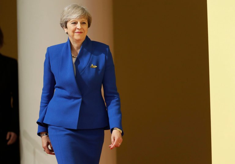 British Prime Minister Theresa May, leader of the Conservatives, faces opposition from the Left on raising wages for the public sector, even though the U.K. has a deficit. (AP Photo/Michael Sohn)