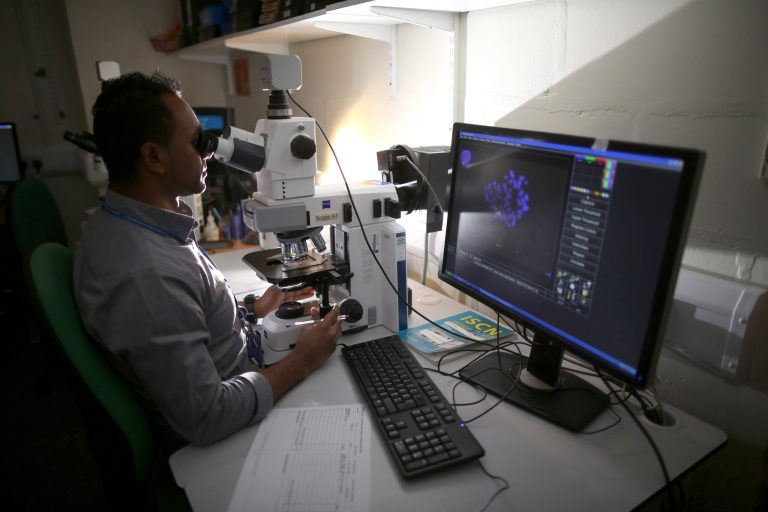 A scientist observes chromosomes through a microscope at Birmingham Women's Hospital on Jan. 22, 2015 in Birmingham, England. (Photo by Christopher Furlong/Getty Images)