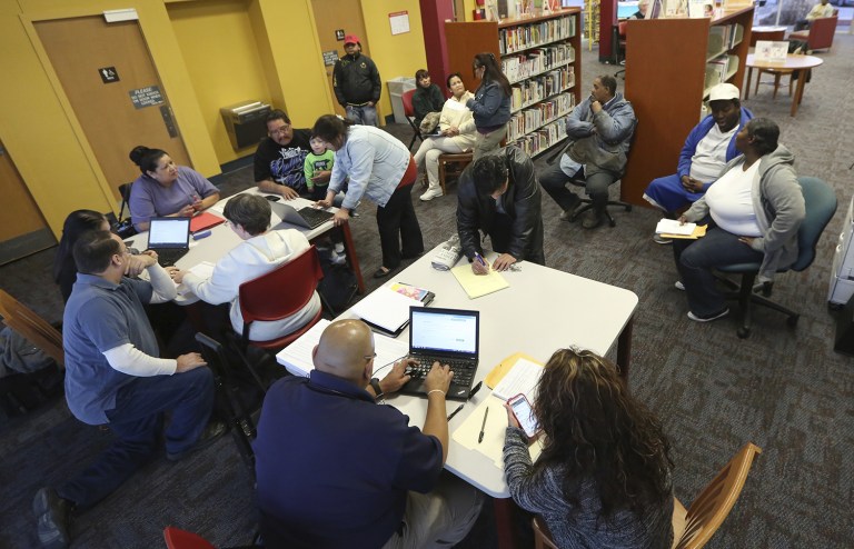 Obamacare navigators hold an enrollment event at the Fort Worth Public Library in Fort Worth, Texas. 